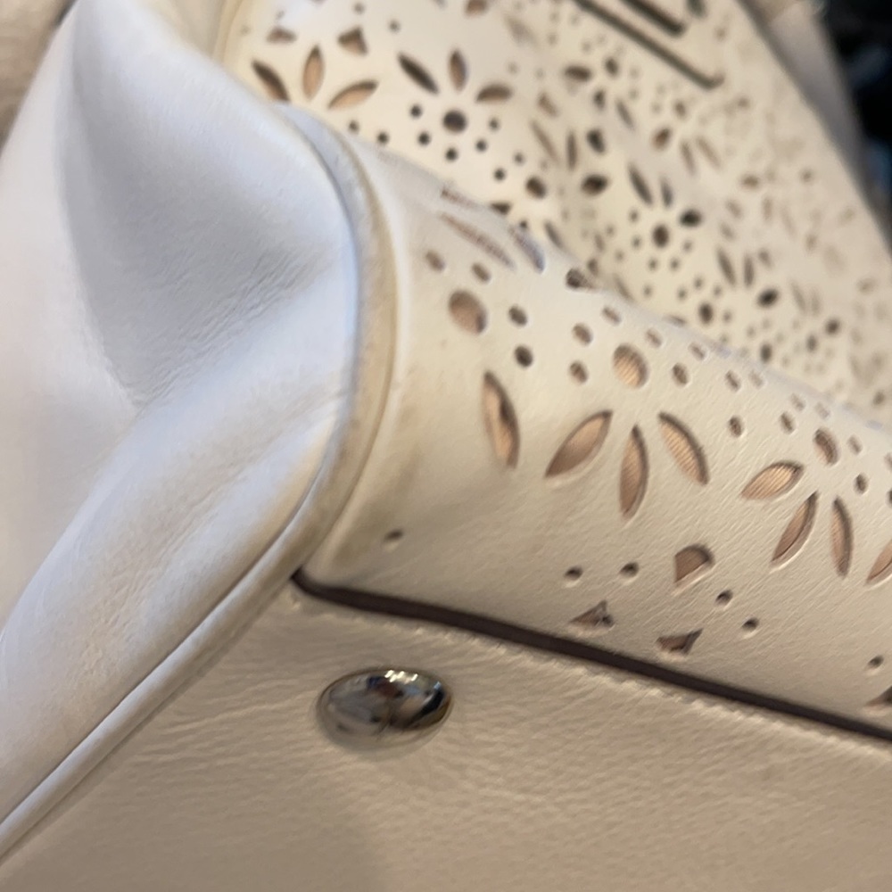 Coach Taylor Perforated Putty White Leather Satchel
12"L x 4.5"W x 8"H - Picture 11 of 11